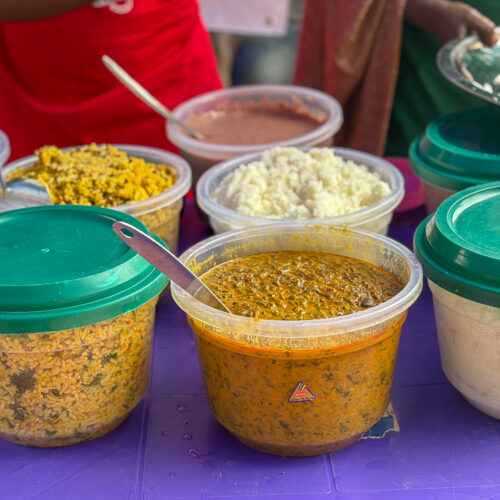 Colorful tubs of food.