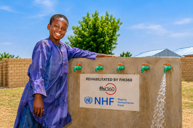 A boy visits a rehabilitated water point.
