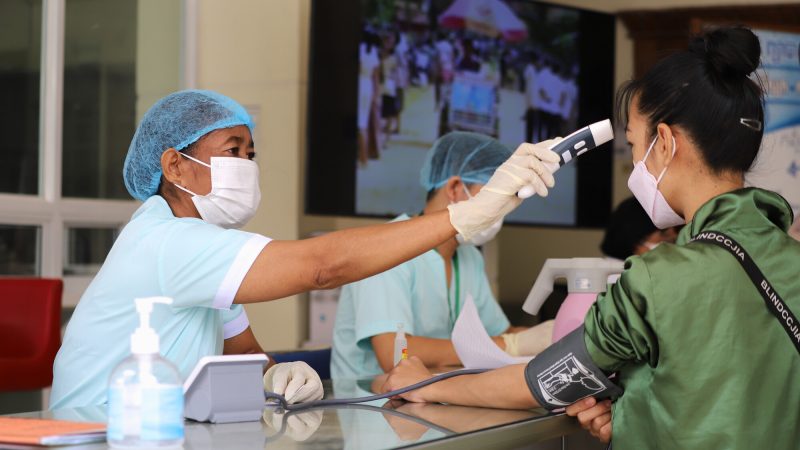 Nurse Bo Phally checks a patient’s temperature as part of a comprehensive health check at the National Center for HIV/AIDS, Dermatology and STD (NCHADS) clinic in Phnom Penh, Cambodia. NCHADS is a partner of FHI 360’s EpiC program’s, which ensures the scalability and sustainability of HIV services that can yield long-term epidemic control. 

Photo credit: Maly Phou for FHI 360.